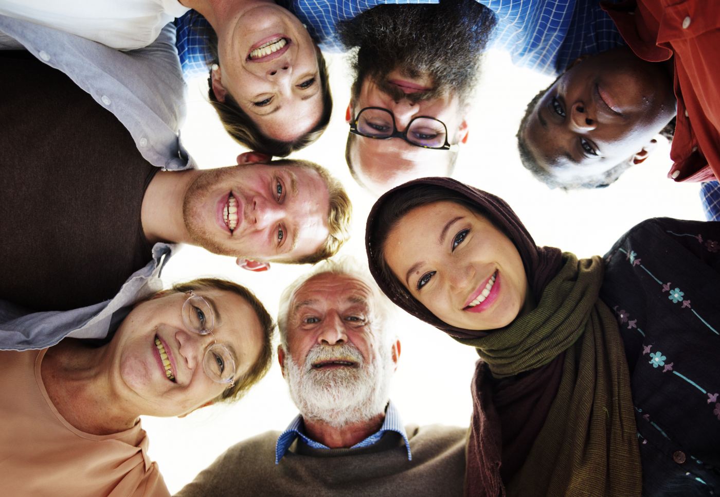 A group of people happily in a circle