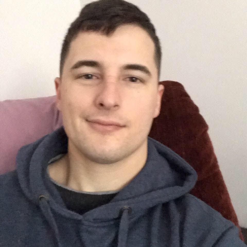 Professional photo of Spencer Lawrence smiling.